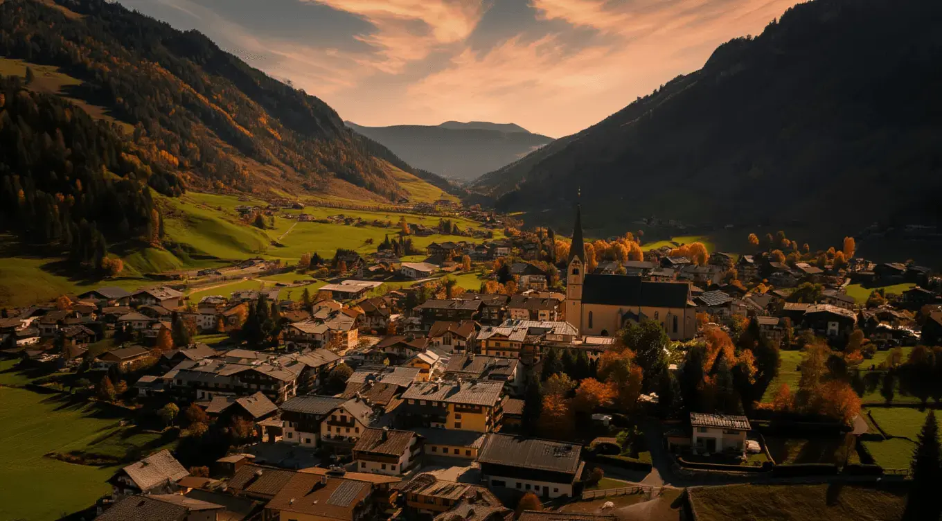 Salzburg Airport to Rauris private transfer Rauris village and church in an autumn Alpine valley within Hohe Tauern National Park